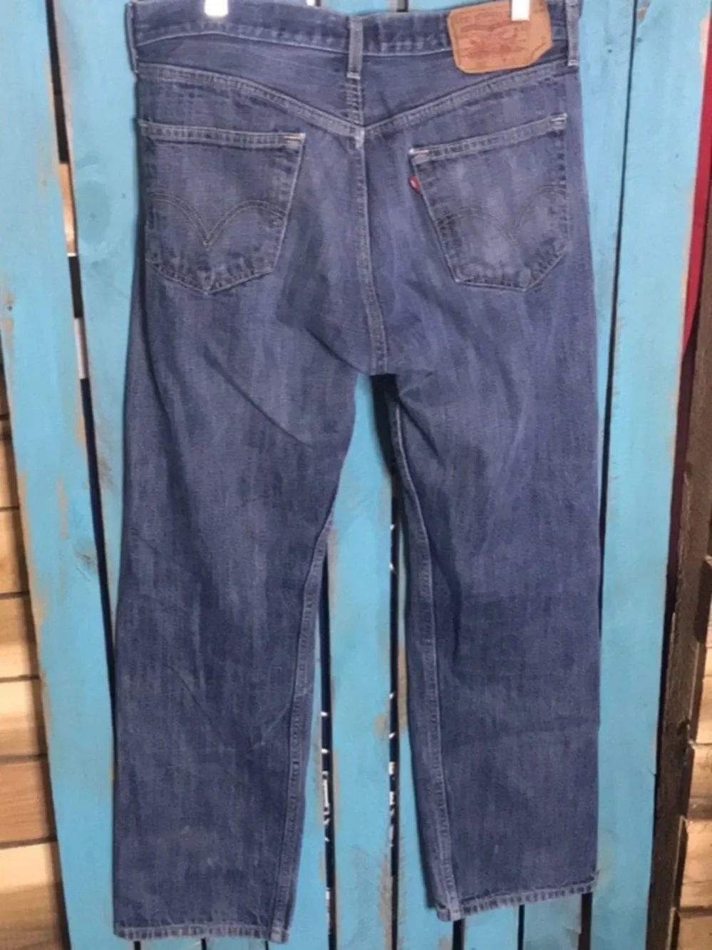 Levi’s 501 button fly Jeans size 35x28 (tag size 36x34) lightly distressed